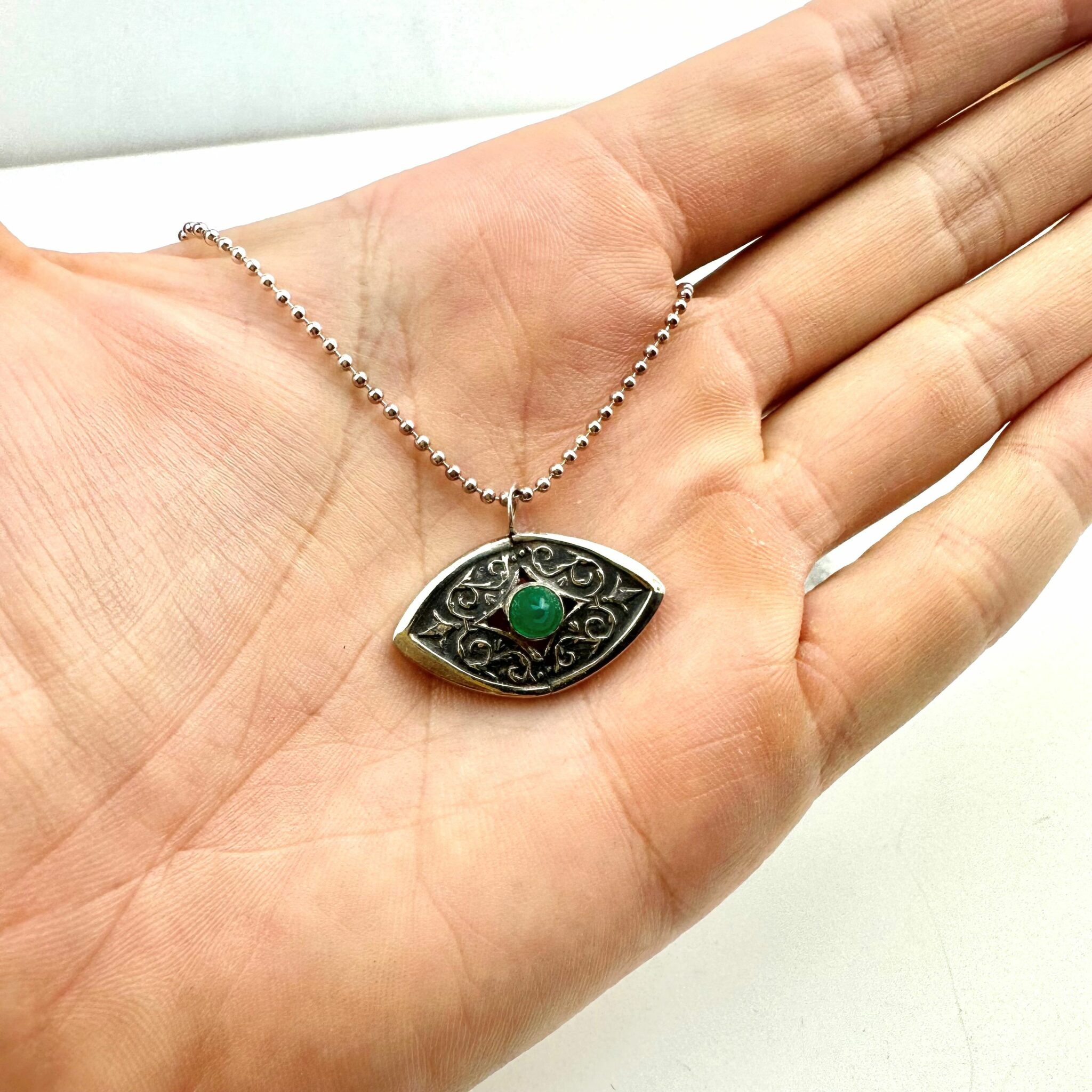 green onyx evil eye cutlery pendant