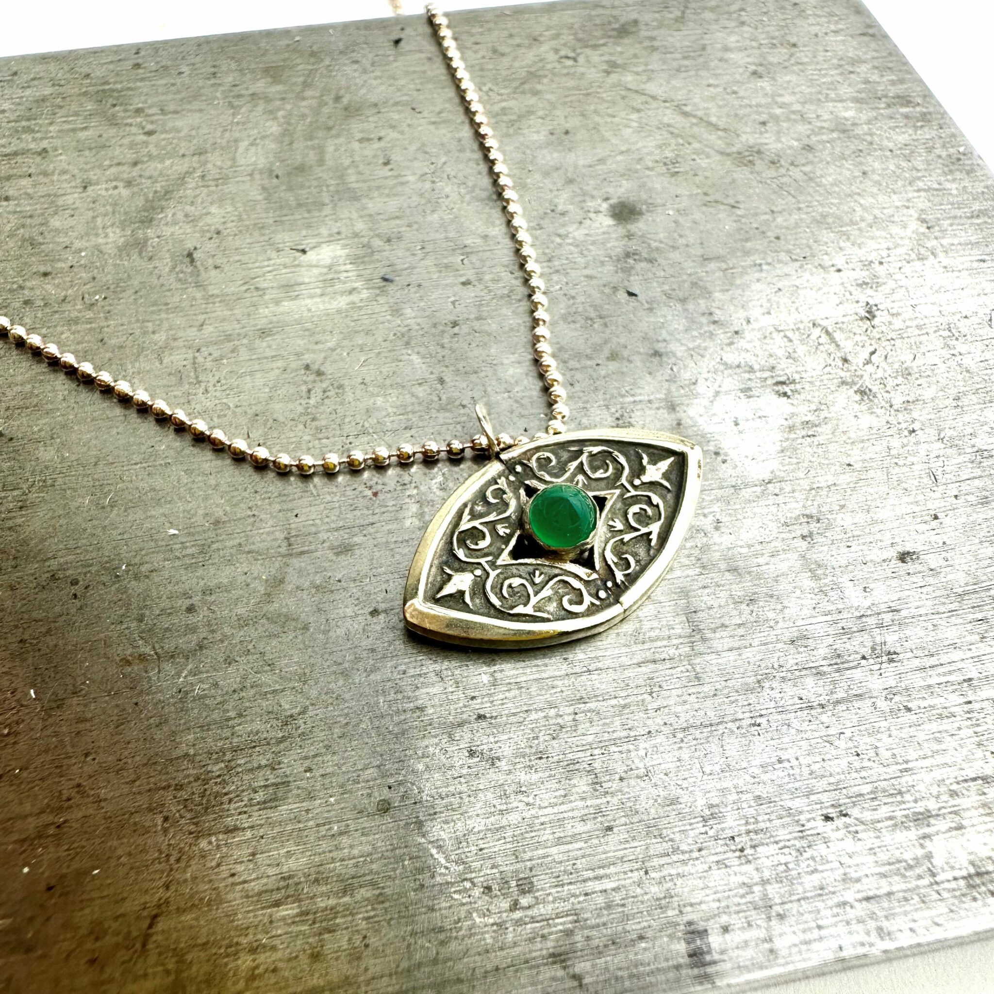 green onyx evil eye cutlery pendant