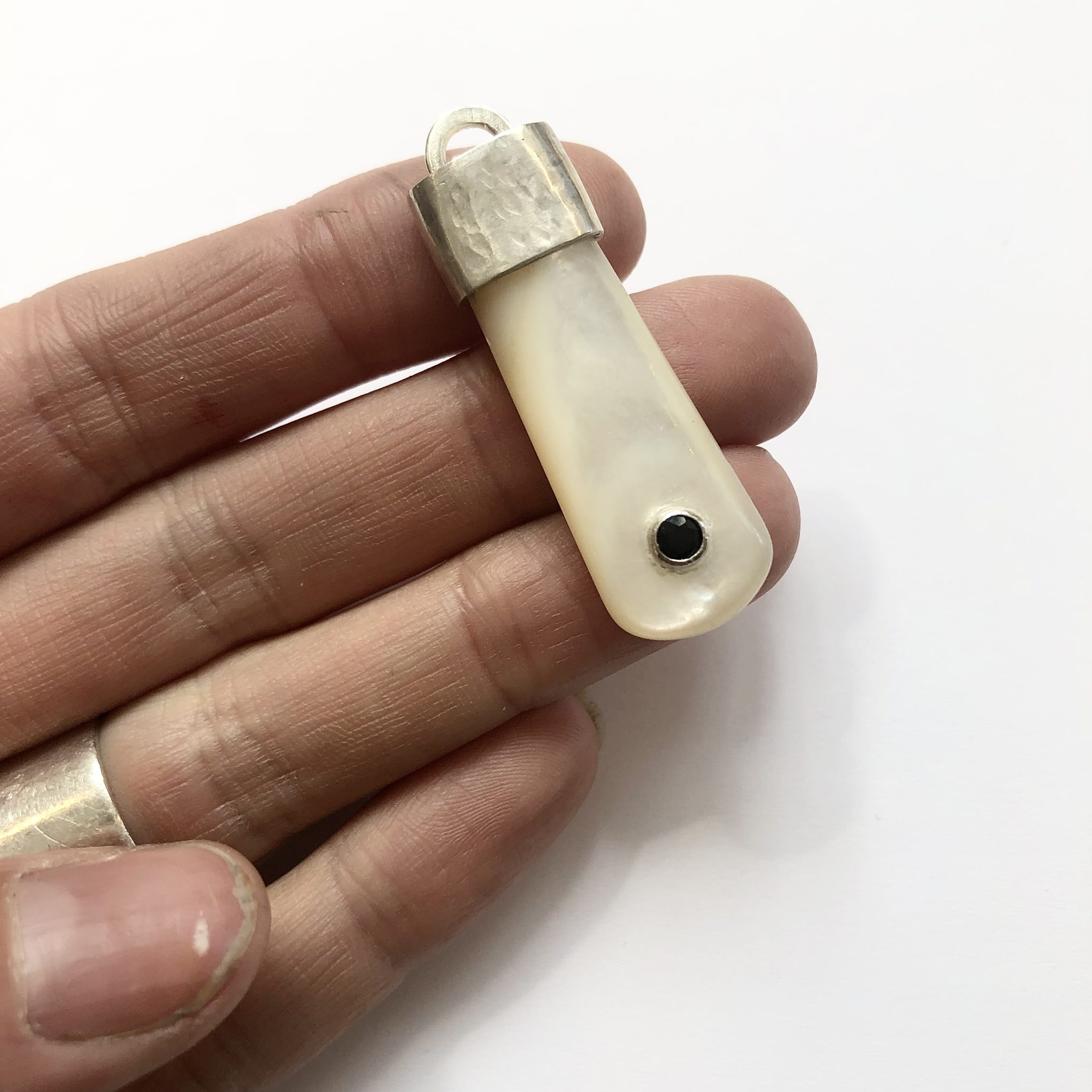 Mother of pearl, sterling silver and sapphire pendant