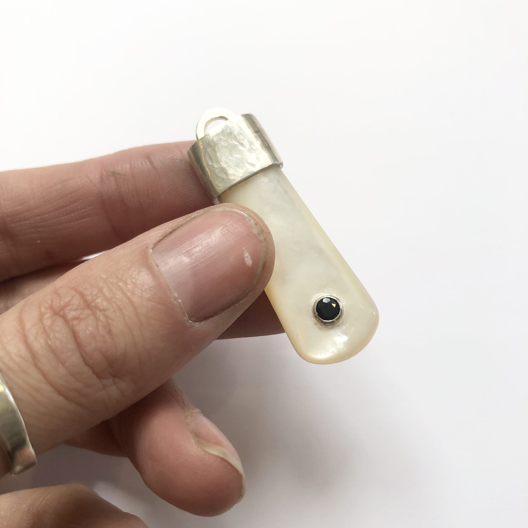 Mother of pearl, sterling silver and sapphire pendant
