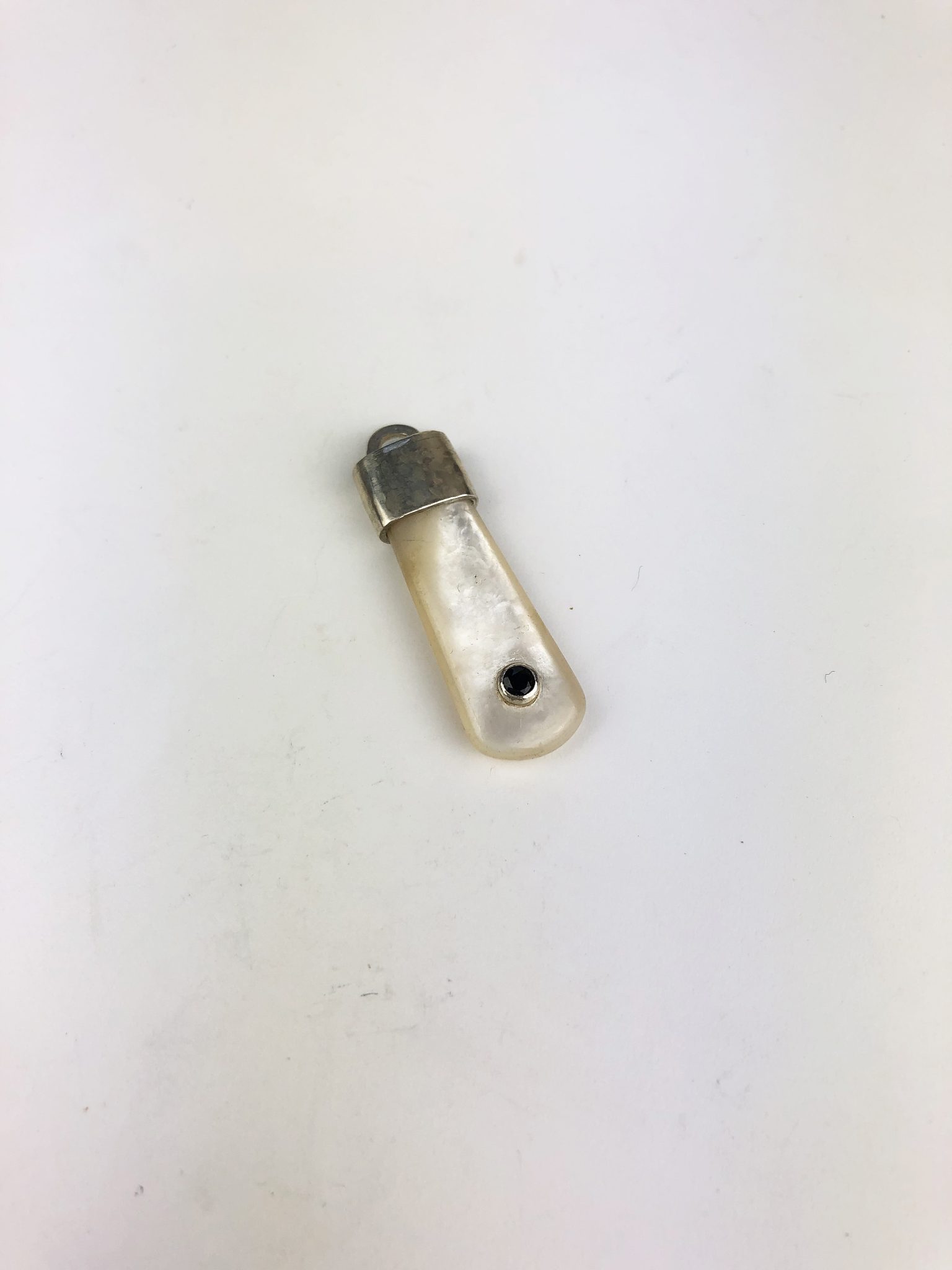 Mother of pearl, sterling silver and sapphire pendant