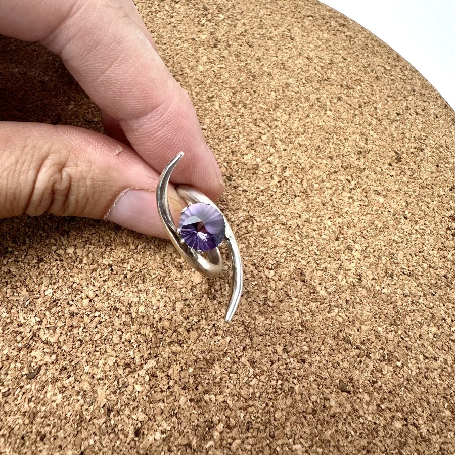 Sterling silver ring with an alexandrite set in a crown, with a yin & yang design on the face