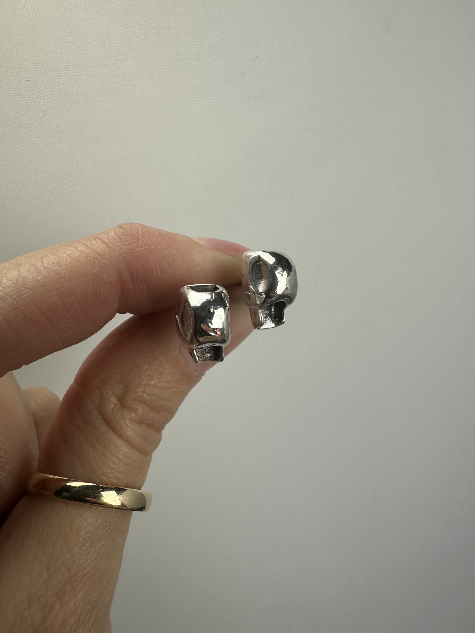 reverse skull studs