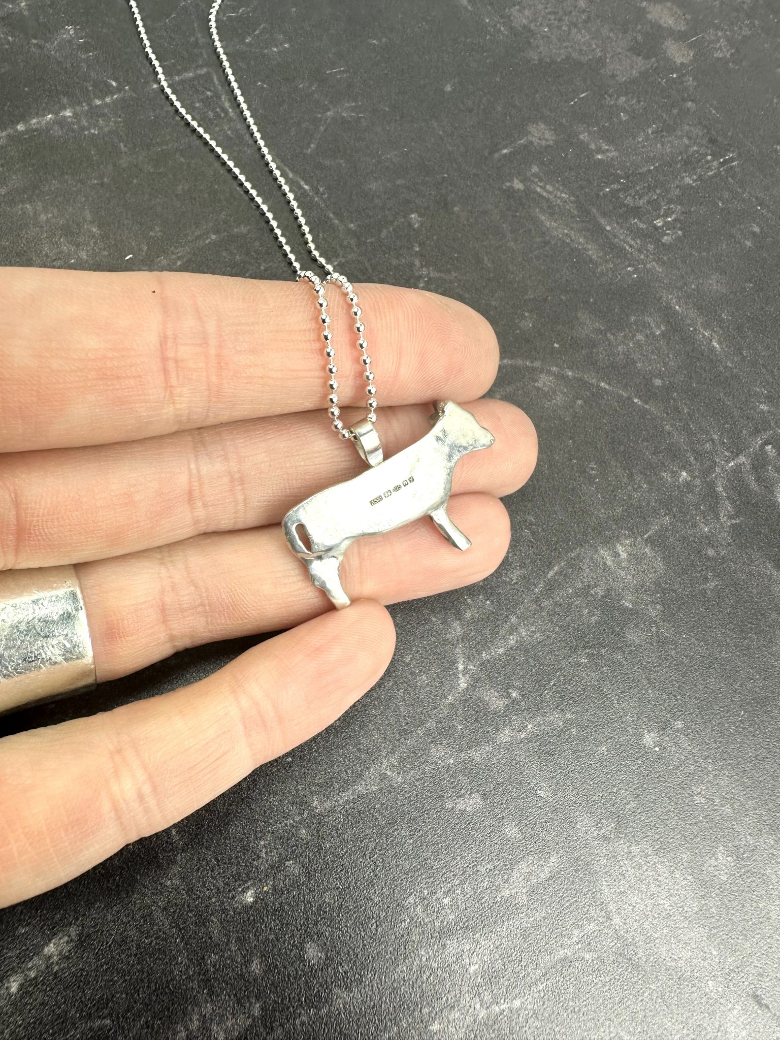 Reverse of the cow pendant
