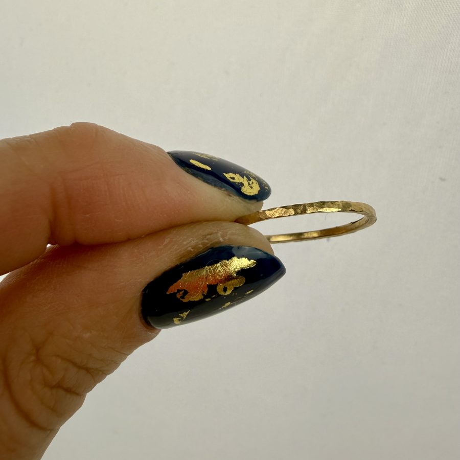 A skinny 9ct gold band, perfect for stacking. Hammered texture for extra sparkle