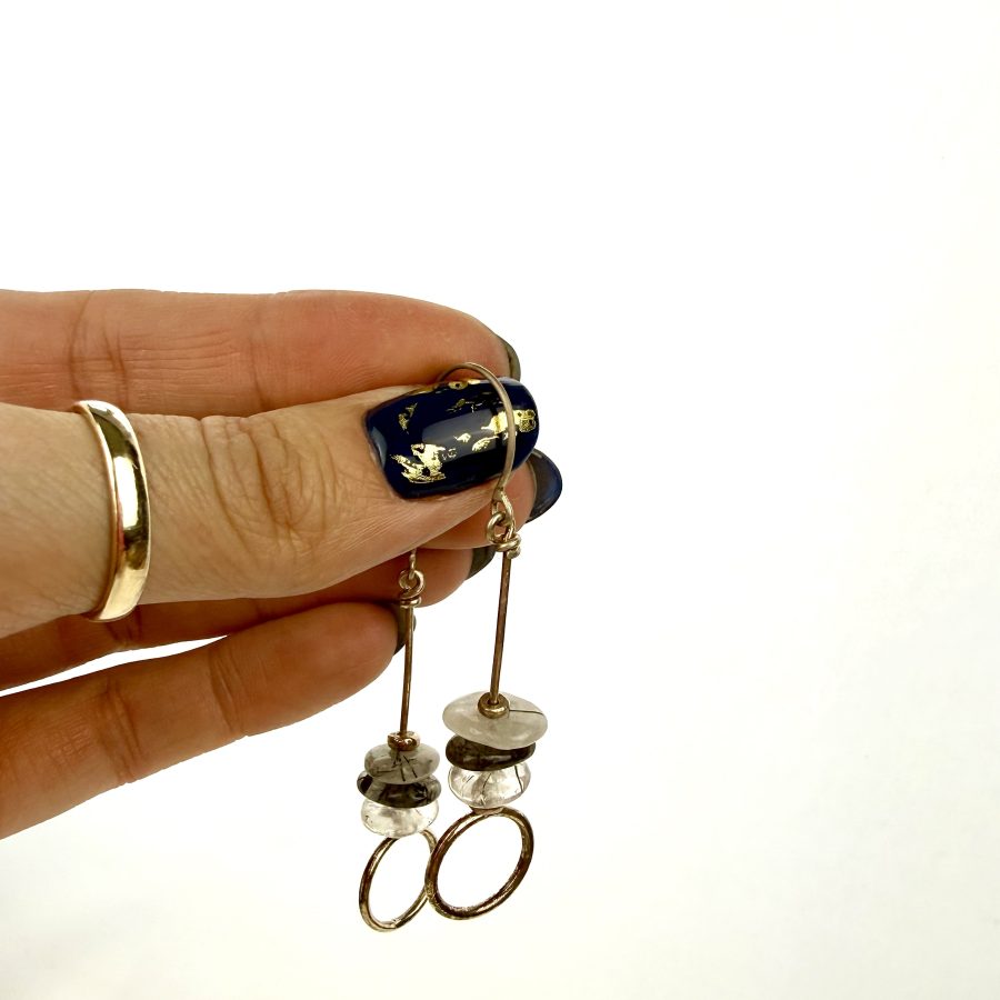 Sterling silver and rutliated quartz long drop earrings, featuring three bead and a loop at the bottom.