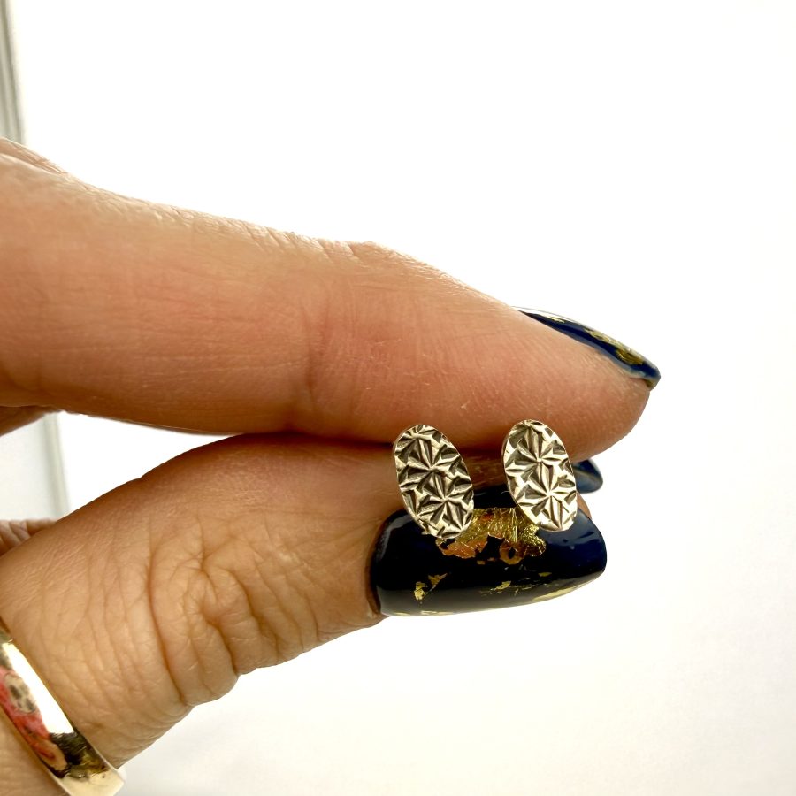 Pair earrings created from a vintage thimble