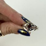 Sterling silver marquise garnet ring with rhodalite garnet accent stones and an open geometric design, bold, and perfect for a modern statement look.